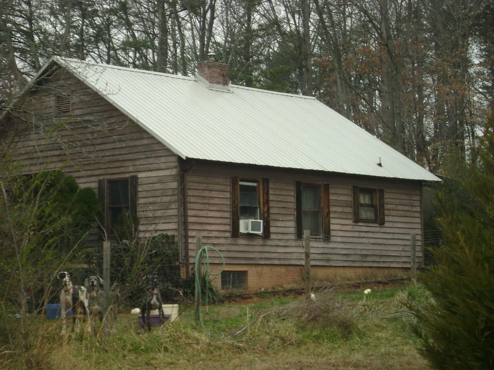 White metal roof on an old wood sided farmhouse, from a Metal Roof Installation job in Valhalla